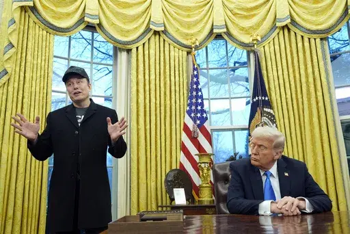 President Donald Trump listens as Elon Musk speaks in the Oval Office at the White House, Tuesday, Feb. 11, 2025, in Washington. (Photo/Alex Brandon)