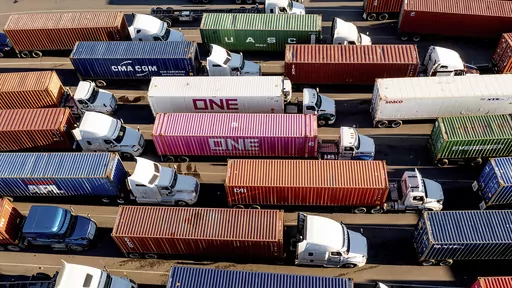 Trucks line up to enter a Port of Oakland shipping terminal on Nov. 10, 2021, in Oakland, Calif. President Joe Biden's administration cleared the way for California's plan to phase out a wide range of diesel-powered trucks, a part of the state's efforts to drastically cut planet-warming emissions and improve air quality in heavy-traffic areas. (AP Photo/Noah Berger, File)