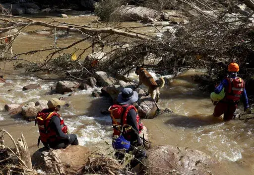 Search and rescue team looking for bodies at Umzinyathi Falls after floods, in Inanda near Durban, South Africa, Tuesday, April 19, 2022.  (AP Photo/Str, File)