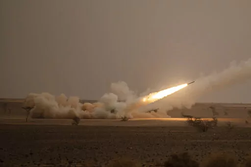 A launch truck fires the High Mobility Artillery Rocket System (HIMARS) at its intended target during the African Lion military exercise in Grier Labouihi complex, southern Morocco, on June 9, 2021. Ukraine has received about a dozen American-built HIMARS multiple rocket launchers and has used them to strike Russian ammunition depots, which are essential for maintaining Moscow's edge in firepower. (AP Photo/Mosa'ab Elshamy, File)