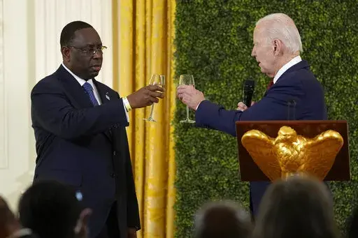 President Joe Biden toasts with Senegalese President Macky Sall in the East Room of the White House in Washington, Wednesday, Dec. 14, 2022, during the U.S.-Africa Leaders Summit dinner. (AP Photo/Susan Walsh)