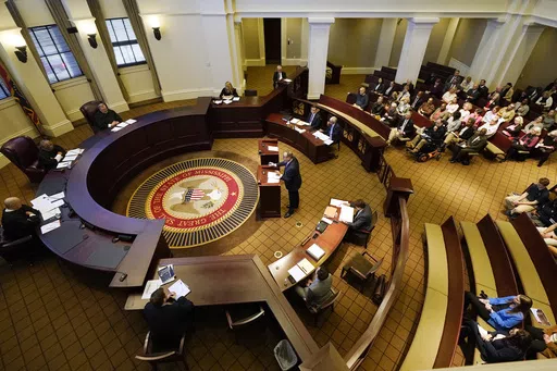 A three-judge panel of the Mississippi Supreme Court listens to arguments over a state law that would put $10 million of federal pandemic relief money into infrastructure grants for private schools, Feb. 6, 2024, in Jackson, Miss. A majority of the court's nine justices ruled Thursday, May 2, that the advocacy group Parents for Public Schools lacked standing to sue the state over the program, and justices declined to rule on the larger question over using public money for private schools. (AP Ph