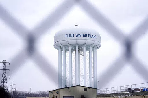 The Flint water plant tower is seen on Jan. 6, 2022, in Flint, Mich. A judge declared a mistrial Thursday, Aug. 11, after jurors said they couldn't reach a verdict in a dispute over whether two engineering firms should bear some responsibility for Flint's lead-contaminated water. Four families accused Veolia North America and Lockwood, Andrews & Newman, known as LAN, of not doing enough to get Flint to treat the highly corrosive water or to urge a return to a regional water supplier. (AP Photo/C