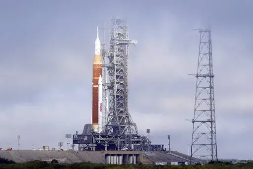 FILE -The NASA Artemis rocket with the Orion spacecraft aboard stands on pad 39B at the Kennedy Space Center in Cape Canaveral, Fla., March 18, 2022. After a series of equipment problems, NASA attempted an abbreviated fueling test of its mega moon rocket Thursday, April 14, 2022 at Florida's Kennedy Space Center. (AP Photo/John Raoux, File)