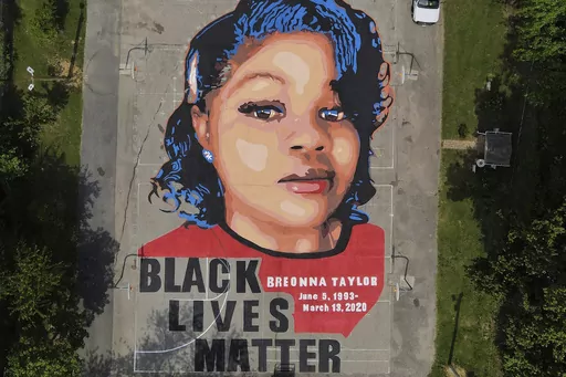 A ground mural depicting a portrait of Breonna Taylor is seen at Chambers Park in Annapolis, Md., July 6, 2020. The U.S. Justice Department has found Louisville police have engaged in a pattern of violating constitutional rights following an investigation prompted by the fatal police shooting of Taylor. The announcement was made Wednesday, March 8, 2023, by Attorney Merrick Garland. (AP Photo/Julio Cortez, File)