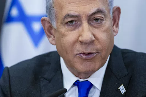 Israeli Prime Minister Benjamin Netanyahu chairs a cabinet meeting at the Kirya military base, which houses the Israeli Ministry of Defense, in Tel Aviv, Israel, on Dec. 24, 2023. The chief prosecutor of the International Criminal Court said Monday, May 20, 2024 he is seeking arrest warrants for Israeli and Hamas leaders, including Israeli Prime Minister Benjamin Netanyahu, in connection with their actions during the seven-month war between Israel and Hamas. (AP Photo/Ohad Zwigenberg, Pool, File