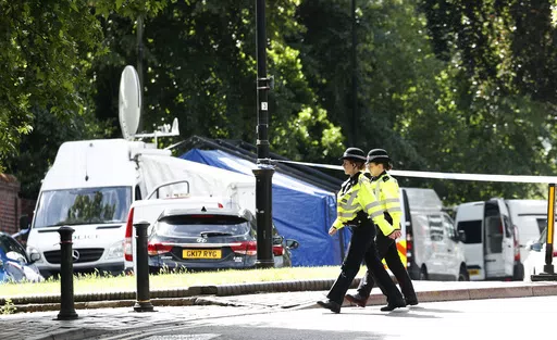 Police patrol outside Forbury Gardens, a day after a multiple stabbing attack in the gardens in Reading, England, Sunday June 21, 2020. Knife crimes are on the rise in England and Wales, and a string of deadly attacks in recent years has stoked public anxiety and led to calls for the government to do more. (AP Photo/Alastair Grant, File)