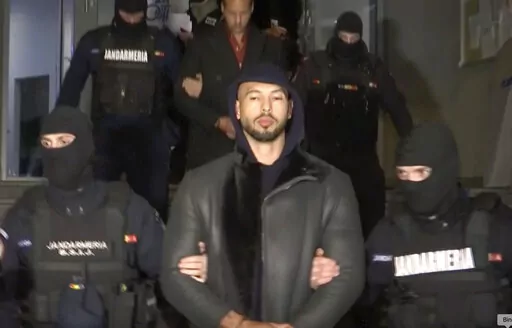 In this grab taken from video released by Observator Antena 1, Social Media personality Andrew Tate is led away by police, in the Ilfov area, north of Bucharest, Romania, Thursday, Dec. 29, 2022. Romanian news outlets are reporting that divisive social media personality Andrew Tate has been arrested on charges of human trafficking and rape. The reports say Tate and his brother Tristan were detained late Thursday. Romania’s anti-organized crime agency said two British citizens and two Romanians