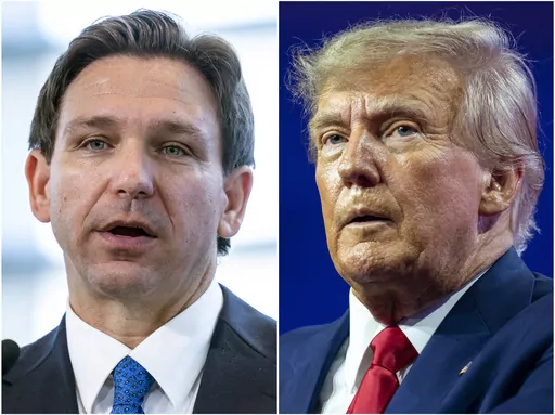 This combination of photos shows Florida Gov. Ron DeSantis speaking on April 21, 2023, in Oxon Hill, Md., left, and former President Donald Trump speaking on March 4, 2023, at National Harbor in Oxon Hill, Md. The competition between Trump and DeSantis is intensifying as the former president is scheduling a return trip to Iowa on the same day that the Florida governor was already going to be in the state that will kick off the Republican contest for the White House. (AP Photo/Alex Brandon)