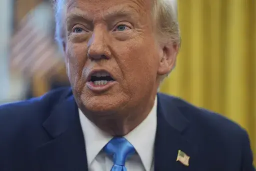 President Donald Trump speaks to reporters as he signs executive orders in the Oval Office of the White House, Tuesday, Feb. 4, 2025, in Washington. (AP Photo/Evan Vucci)