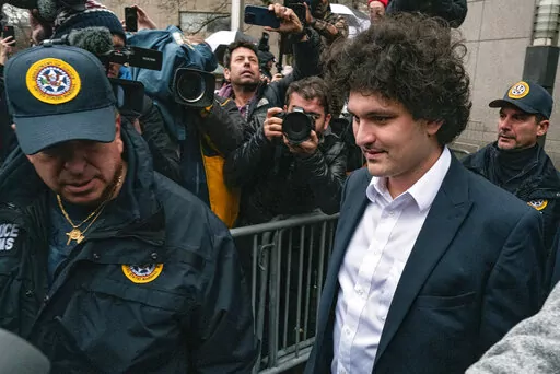 FTX founder Sam Bankman-Fried leaves Manhattan federal court, Tuesday, Jan. 3, 2023, in New York, after he pleaded not guilty to charges that he cheated investors and looted customer deposits on his cryptocurrency trading platform. (AP Photo/Craig Ruttle)