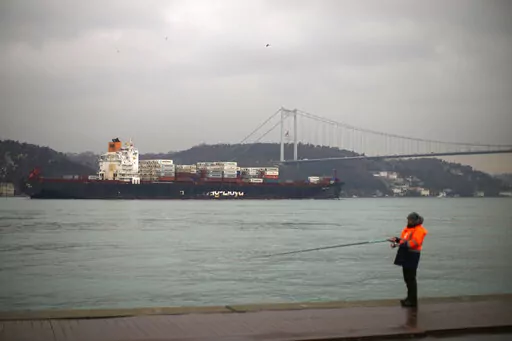 Cargo ship Oakland crosses the Bosphorus strait towards the Marmara sea after departing from Russia's Novorossiysk port, in Istanbul, Tuesday, March 1, 2022. Turkey, which is trying to balance its support for Ukraine with its fragile economic ties to Russia, said Monday it is implementing an international convention that allows the country to shut down the straits at the entrance of the Black Sea to warships, to avoid an escalation of the conflict. (AP Photo/Francisco Seco, File)