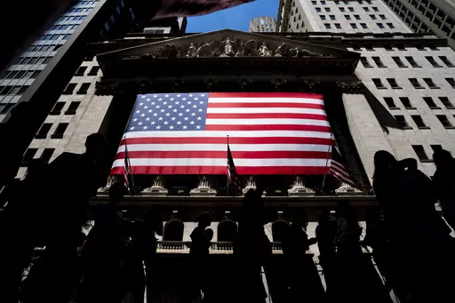 People walk past the New York Stock Exchange on Wednesday, June 29, 2022 in New York. Wall Street’s best week of the year is getting even better Friday, Nov. 3, 2023, following a cooler-than-expected report on the job market. (AP Photo/Julia Nikhinson)