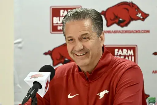 John Calipari answers questions from reporters during a press conference after being introduced as Arkansas's NCAA college head basketball coach Wednesday, April 10, 2024, in Fayetteville, Ark. (AP Photo/Michael Woods, File)
