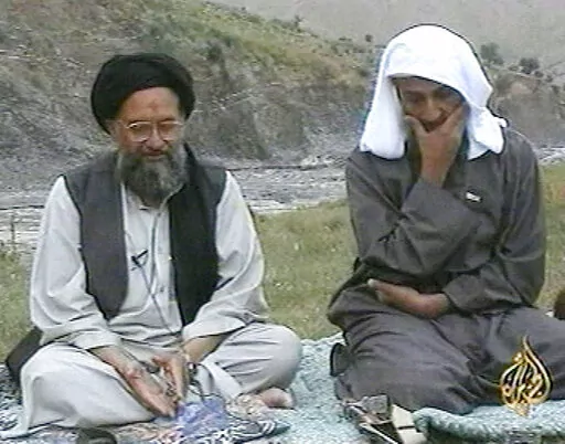 In this television image from Arab satellite station Al-Jazeera, Osama bin Laden, right, listens as his top deputy Ayman al-Zawahri speaks at an undisclosed location, in this image made from undated video tape broadcast by the station April 15, 2002. A U.S. airstrike has killed al-Qaida leader Ayman al-Zawahri in Afghanistan, according to a person familiar with the matter. President Joe Biden will speak about the operation on Monday night, Aug. 1, 2022, from the White House. (AP Photo/Al-Jazeera