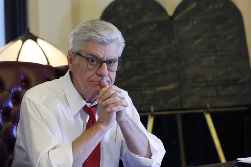 Gov. Phil Bryant ponders a response to a question regarding his legacy following a life of public service, while sitting in his Jackson, Miss., Capitol office, on Jan. 8, 2020. The former governor said Wednesday, May 3, 2023, that he will release all of his text messages related to a welfare fraud investigation — including money spent on building a university volleyball arena, a project backed by retired NFL quarterback Brett Favre and others with connections to Bryant. (AP Photo/Rogelio V. So