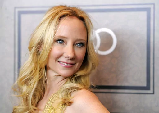 Actor Anne Heche poses at Variety's 4th annual Power of Women event in Beverly Hills, Calif., on Oct. 5, 2012. A spokesperson for  Heche says the actor is on life support after suffering a brain injury in a fiery crash a week ago and isn't expected to survive. The statement released on behalf of her family said she is being kept on life support to determine if she is a viable organ donor. (Photo by Chris Pizzello/Invision/AP, File)