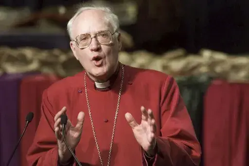 The Archbishop of Canterbury George Carey leads a morning worship service at the United Methodist Church General Conference in Cleveland on May 10, 2000. (AP Photo/Mark Duncan, File)