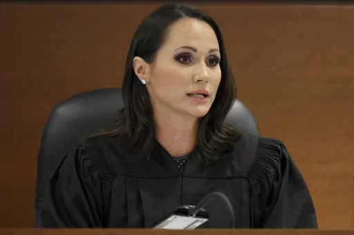Judge Elizabeth Scherer sentences Parkland shooter Nikolas Cruz at the Broward County Courthouse in Fort Lauderdale, Fla., on Nov. 2, 2022. The Florida judge who gained a national profile while presiding over the Parkland school shooting trial announced Wednesday, May, 10, 2023, that she is resigning June 30 to pursue unspecified career opportunities. (Amy Beth Bennett/South Florida Sun Sentinel via AP, Pool, File)