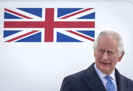 Britain's King Charles III stands in front of the plane after arriving at Berlin Airport in Berlin, Germany, Wednesday, March 29, 2023. King Charles III for the first time has signaled support for research into the British monarchy’s ties to slavery. A Buckingham Palace spokesperson made the announcement Thursday, April 6 after a document showed an ancestor of his with shares in a slave-trading company. (Britta Pedersen/dpa via AP, File)