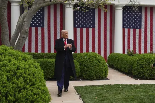 President Donald Trump walks to the Oval Office after signing an executive order during an event to announce new tariffs in the Rose Garden of the White House, Wednesday, April 2, 2025, in Washington. (AP Photo/Evan Vucci)