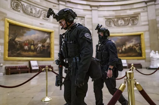 Members of the U.S. Secret Service Counter Assault Team walk through the Rotunda as they and other federal police forces responded as violent protesters loyal to President Donald Trump stormed the U.S. Capitol in Washington, Jan. 6, 2021. Top congressional Democrats are demanding that the Department of Homeland Security’s inspector general hand over information on deleted Secret Service text messages related to the Jan. 6, 2012 attack on the Capitol, accusing him of using delay tactics to ston