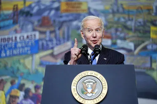 President Joe Biden speaks at the North America's Building Trades Unions (NABTU) Legislative Conference at the Washington Hilton in Washington, April 6, 2022. The U.S. economy faces plenty of threats: War in Ukraine, high grocery bills, spiking gasoline prices, splintered supply chains, the lingering pandemic and rising interest rates that slow growth.  The Biden White House is betting the U.S. economy is strong enough to withstand these threats, but there are growing fears of a coming economic 