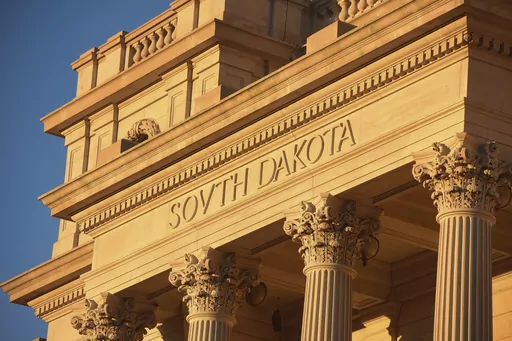 Sun shines on South Dakota Capitol, Jan. 12, 2021, in Pierre, S.D. South Dakota officials will no longer deny applications for personalized license plates based on a state law that says any plate can be denied if it’s found to be “offensive to good taste and decency.” Officials agreed to the change as part of a settlement approved by a judge on Friday. As part of the settlement, state officials acknowledged that the “good taste and decency” language is unconstitutional. (Erin Bormett/T