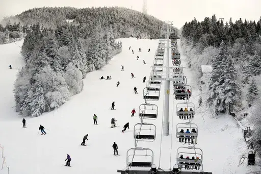 Thanksgiving holiday skiers descend near the North Ridge Quad chairlift, Nov. 24, 2023, at Killington Ski Resort in Killington, Vt. (AP Photo/Robert F. Bukaty, File)
