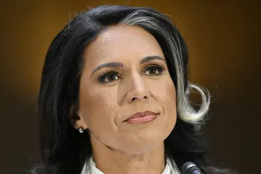 Tulsi Gabbard, President Donald Trump's choice to be the Director of National Intelligence, arrives to appear before the Senate Intelligence Committee for her confirmation hearing on Capitol Hill Thursday, Jan. 30, 2025, in Washington. (AP Photo/John McDonnell)