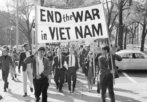 College students from various nearby schools march down Commonwealth Avenue in Boston on Oct. 16, 1965 to attend rally on Boston Common protesting U.S. involvement in Vietnam. They’re hallmarks of American history: protests, rallies, sit-ins, marches, disruptions. They date from the early days of what would become the United States to the sights and sounds currently echoing across the landscapes of the nation’s colleges and universities. (AP Photo/Frank C. Curtin, File)