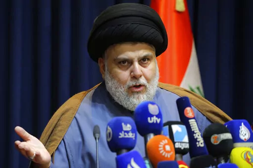 Populist Shiite cleric Muqtada al-Sadr, speaks during a mews conference in Najaf, Iraq, Nov. 18, 2021. Residents of the impoverished Baghdad suburb of Sadr City say they they support al-Sadr an influential Shiite cleric who called on thousands of his followers to storm Iraq's parliament. Al-Sadr derives his political weight largely from their seemingly unending support. And yet, they are among Iraq’s most destitute. (AP Photo/Anmar Khalil, File)