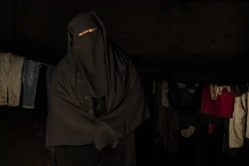 Marwa Ahmad poses for a photo in Raqqa, Syria, Wednesday, Dec. 28, 2022. Ahmad is among tens of thousands of widows and wives of IS militants who were detained in the wretched and lawless al-Hol camp in northeastern Syria after U.S.-led coalition and Syrian Kurdish forces cleared IS from northeastern Syria in 2019. (AP Photo/Baderkhan Ahmad)