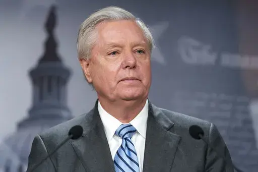 Sen. Lindsey Graham, R-S.C., speaks with reporters about aid to Ukraine, on Capitol Hill, Wednesday, March 10, 2022, in Washington. Attorneys representing Graham said Wednesday, July 6, that he intends to challenge a subpoena compelling him to testify before a special grand jury in Georgia investigating former President Donald Trump and his allies' actions after the 2020 election. (AP Photo/Alex Brandon, File)