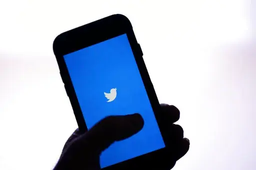 The Twitter application is seen on a digital device Monday, April 25, 2022, in San Diego.  The number of posts on Twitter containing racial slurs has soared since Elon Musk purchased the influential platform, new research shows. Analysts at the Center for Countering Digital Hate searched for English-language posts containing one of several different racial slurs. They found that the use of all of them went up in the first full week after Musk bought Twitter.  (AP Photo/Gregory Bull, File)