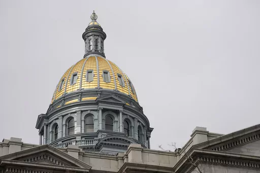 The gold dome of the Colorado State Capitol on March 23, 2023, in Denver. In Colorado, House lawmakers approved a measure Wednesday, April 12, that would lower the maximum interest rate for medical debt to 3%, require greater transparency in costs of treatment and prohibit debt collection during an appeals process. (AP Photo/David Zalubowski, File)