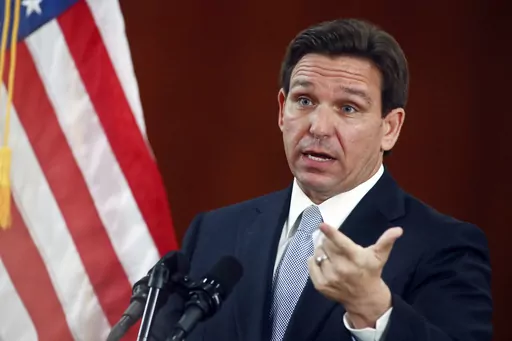 Florida Gov. Ron DeSantis answers questions from the media in the Florida Cabinet following his State of the State address during a joint session of the Senate and House of Representatives on March 7, 2023, at the state Capitol in Tallahassee, Fla. The fate of abortion rights in Florida is at stake Friday, Sept. 8, 2023 when the state Supreme Court takes up a challenge to a law banning the procedure in most cases after 15 weeks of pregnancy, which will determine whether an even stricter six-week