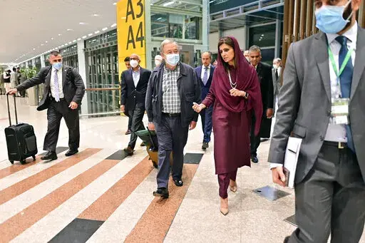 In this handout photo released by Pakistan Foreign Ministry Press Service, U.N. Secretary-General Antonio Guterres, center, was received on his arrival by Deputy Foreign Minister Hina Rabbani Khar, second right, in Islamabad, Pakistan, Friday, Sept. 9, 2022. U.N. Guterres appealed to the world to help Pakistan after arriving in the country Friday to see damage from the record floods that have killed hundreds and left more than half a million people homeless and living in tents under the open sky