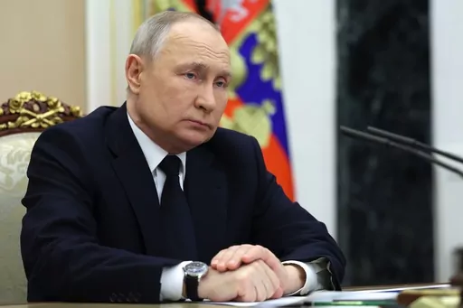 Russian President Vladimir Putin listens to Russian Transport Minister Vitaly Savelyev during their meeting in Moscow, Russia, Saturday, March 25, 2023. (Gavriil Grigorov, Sputnik, Kremlin Pool Photo via AP)