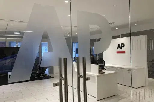 The Associated Press logo is shown at the entrance to the news organization's office in New York on Thursday, July 13, 2023. (AP Photo/Aaron Jackson, File