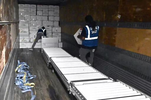 The first boxes of the Johnson & Johnson COVID-19 vaccine are loaded into a truck for shipment from the McKesson facility in Shepherdsville, Ky., Monday, March 1, 2021.  As demand for COVID-19 vaccines collapses in many areas of the U.S., states are scrambling to use stockpiles of doses before they expire and have to be added to the millions that have already gone to waste. (AP Photo/Timothy D. Easley, Pool, File)