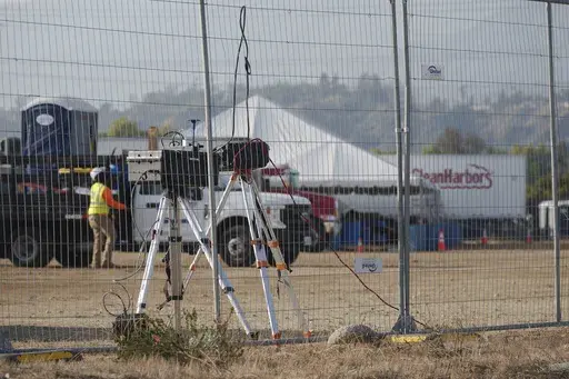 Air quality monitoring equipment is seen at Lario Park, used temporarily by the U.S. Environmental Protection Agency (EPA) to process hazardous materials from the Eaton Fire, in Irwindale, Calif., Friday, Jan. 31, 2025. (AP Photo/Damian Dovarganes)