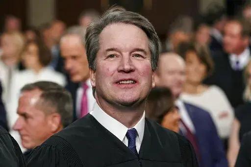 Supreme Court Associate Justice Brett Kavanaugh watches as President Donald Trump arrives to give his State of the Union address to a joint session on Congress at the Capitol in Washington, on Feb. 5, 2019. A new documentary looks into the sexual misconduct allegations against Kavanaugh and raises questions about the depth of the FBI investigation in 2018. “Justice,” from filmmaker Doug Liman, debuted Friday, Jan. 20, 2023, at the Sundance Film Festival to a sold-out theater surrounded by ar
