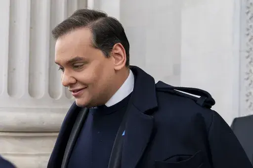 Rep. George Santos, R-N.Y., leaves the Capitol after being expelled from the House of Representatives, Friday, Dec. 1, 2023, in Washington. (AP Photo/Stephanie Scarbrough)