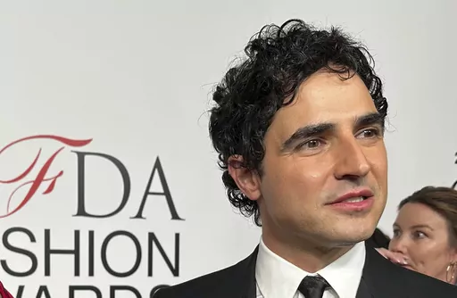 Fashion designer Zac Posen speaks with the media on the red carpet arrival at the Council of Fashion Designers of America awards, Monday, Nov. 6, 2023, in New York. In news announced Monday, Feb. 5, 2024, Gap has tapped Posen as the chain's creative director. (AP Photo/Ted Shaffrey, File)