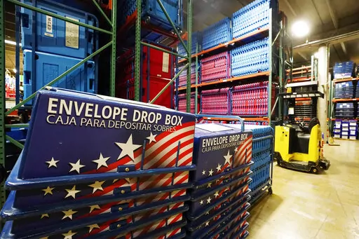 The warehouse at the Maricopa County Elections Department stores all the equipment and signage for all the voting precincts in Phoenix, Sept. 8, 2022. The sheriff in metropolitan Phoenix says he's stepped up security around ballot drop boxes after a series of incidents involving people keeping watch on the boxes and taking video of voters after they were apparently inspired by lies about the 2020 election. (AP Photo/Ross D. Franklin, File)