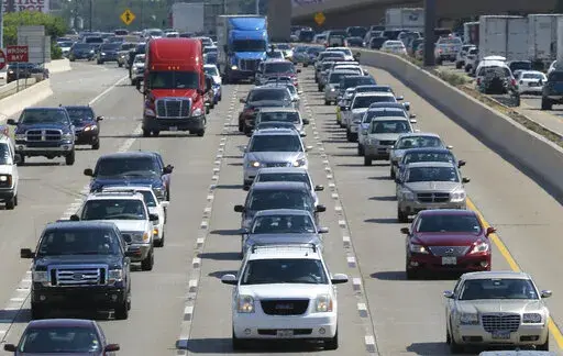 Drivers work their way out of Dallas during rush hour, July 1, 2016. The number of traffic deaths on U.S. roadways fell slightly during the first nine months of 2022, but pedestrian and cyclist deaths continue to rise. (AP Photo/LM Otero, File)