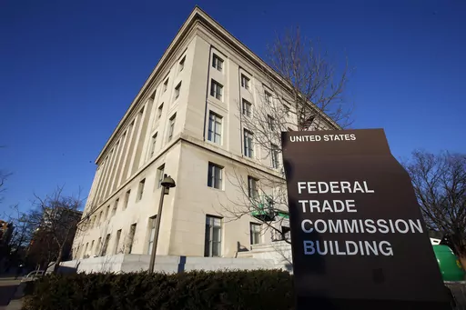 A sign stands outside the Federal Trade Commission building, Jan. 28, 2015, in Washington. The FTC is proposing sweeping changes to a decades-old law that regulates how online companies can track and advertise to children, including turning off targeted ads to kids under 13 by default and limiting push notifications. (AP Photo/Alex Brandon, File)