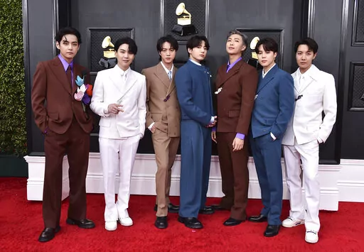 BTS arrives at the 64th Annual Grammy Awards on April 3, 2022, in Las Vegas. The group says they are taking time to focus on solo projects. The seven-member group with hits like “Butter” and “Dynamite” talked about their future in a video posted June 14, celebrating the nine year anniversary of their debut release.  (Photo by Jordan Strauss/Invision/AP, File)