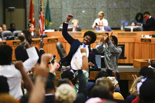 Justin Pearson celebrates with supporters after being reinstated to the the Tennessee House of Representatives by the Shelby County Board of Commissioners building in Memphis, Tenn., on Wednesday, April 12, 2023. Republicans expelled Pearson and Rep. Justin Jones last week over their role in a gun control protest on the House floor after a Nashville school shooting that left three children and three adults dead. (Chris Day/The Commercial Appeal via AP)